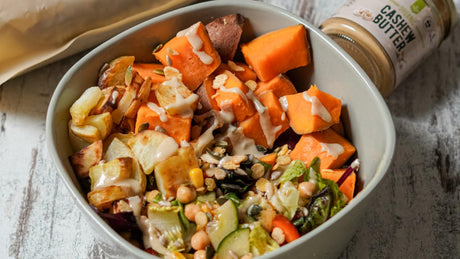 Healthy veggie bowl with sweet potato, chickpeas, and cashew dressing.