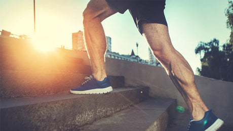 Outdoor stair workout during sunrise for leg and cardio training.