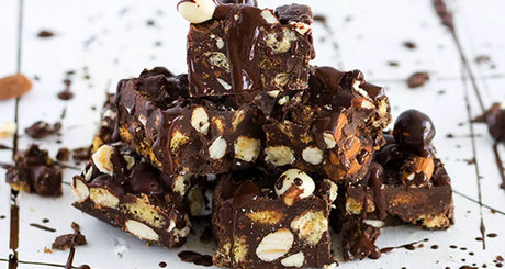 Protein-packed chocolate fudge bites with almonds and biscuits.